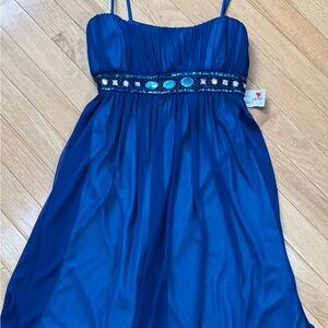 New Party Dress with tie back ribbon with fancy accents on waist size medium